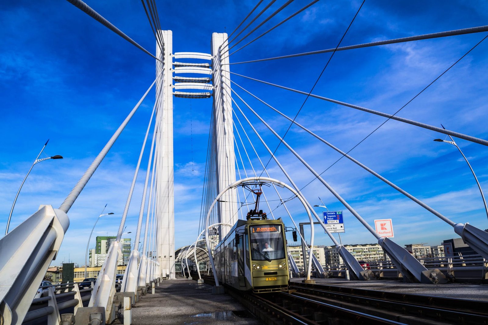 bridge with train under blue sky